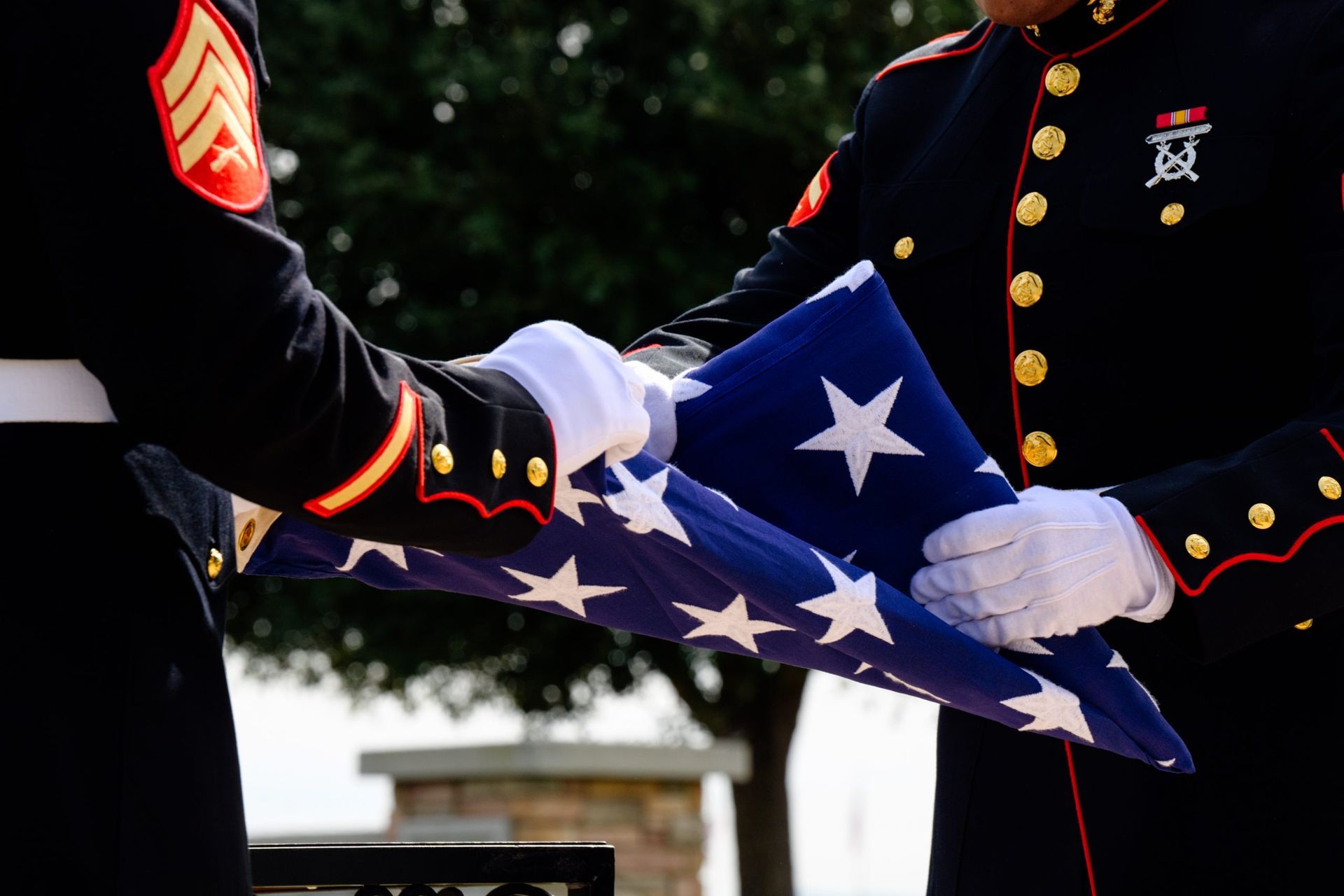 Folding of the American Flag ceremony with two military members