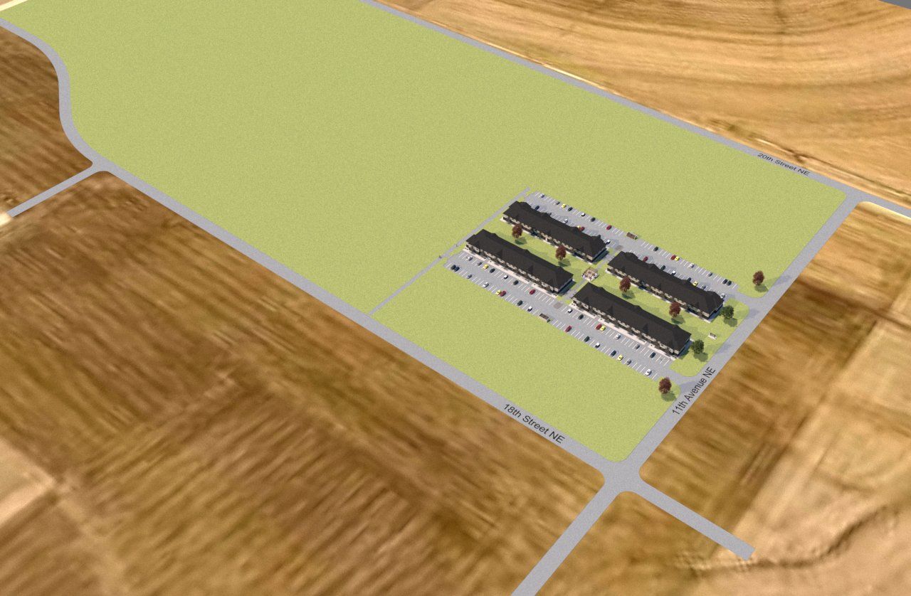 An aerial view of a farm with a lot of buildings