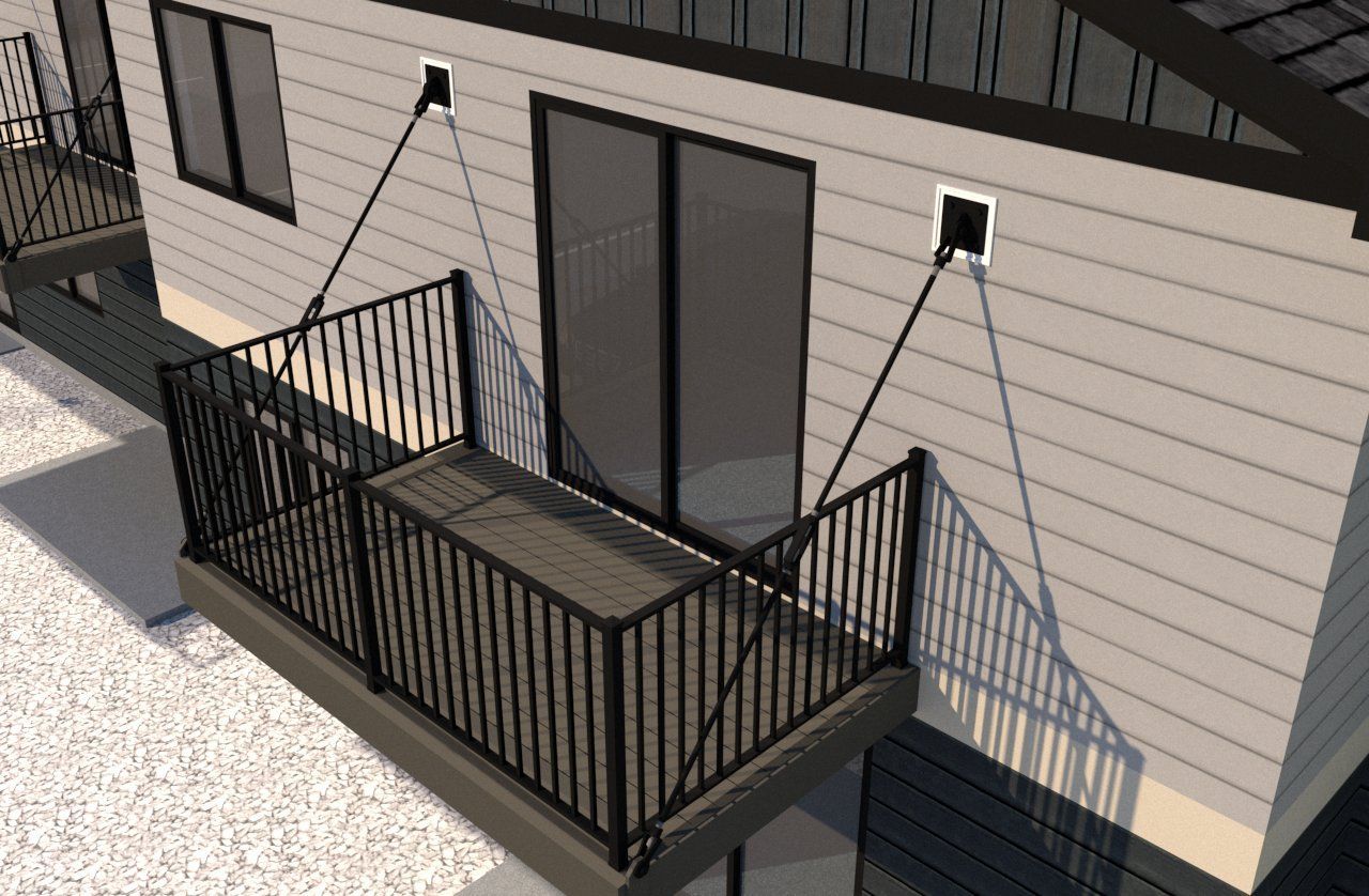 An aerial view of a house with a balcony and sliding glass doors.