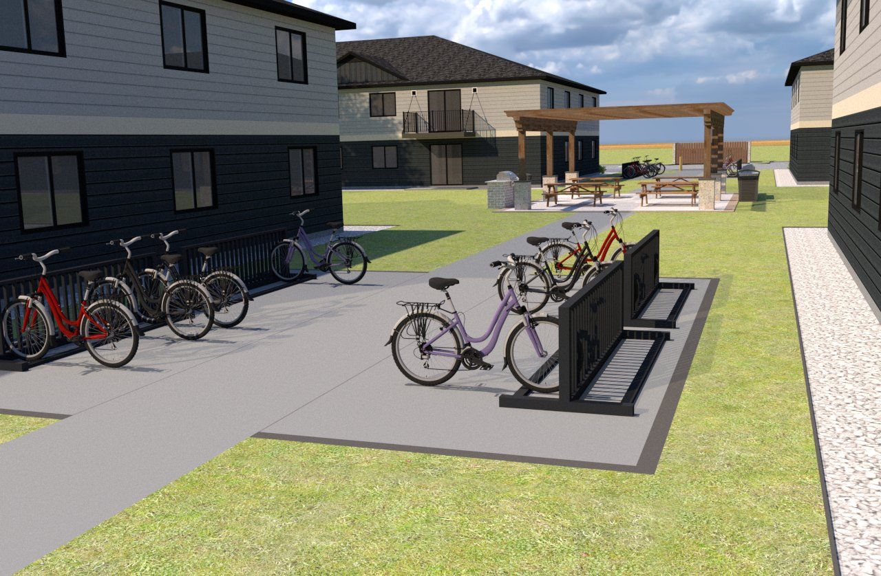 A group of bicycles are parked in front of a building.