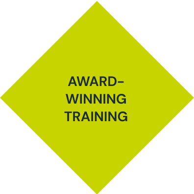 A green diamond with the words award winning training on it