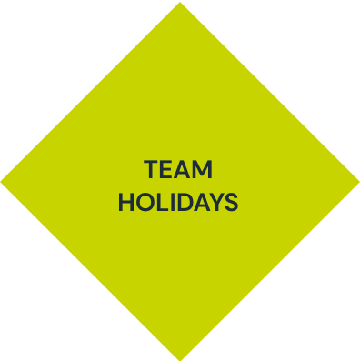 A yellow diamond with the words team holidays on it