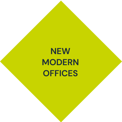 A yellow diamond with the words new modern offices on it