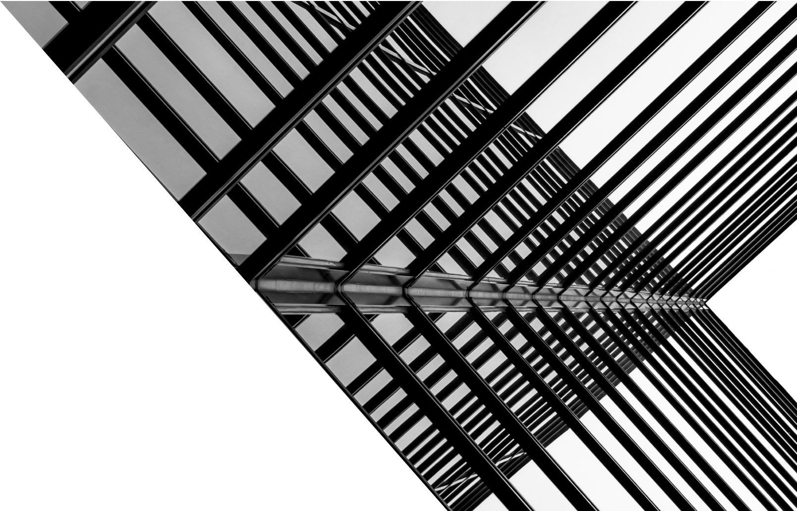 A black and white photo of a building with a striped pattern