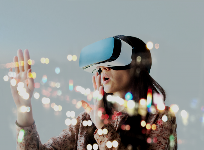 A woman is wearing a virtual reality headset.