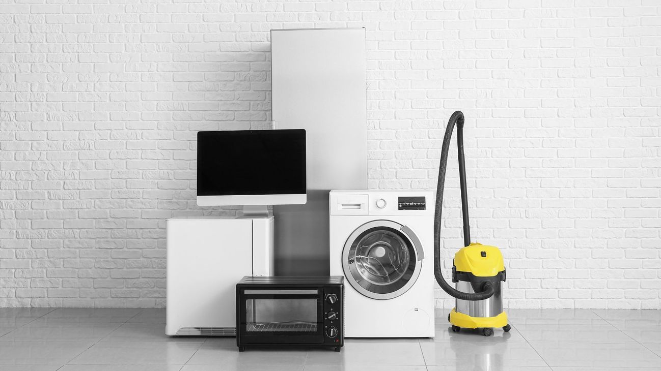 A bunch of appliances are stacked on top of each other in a room.