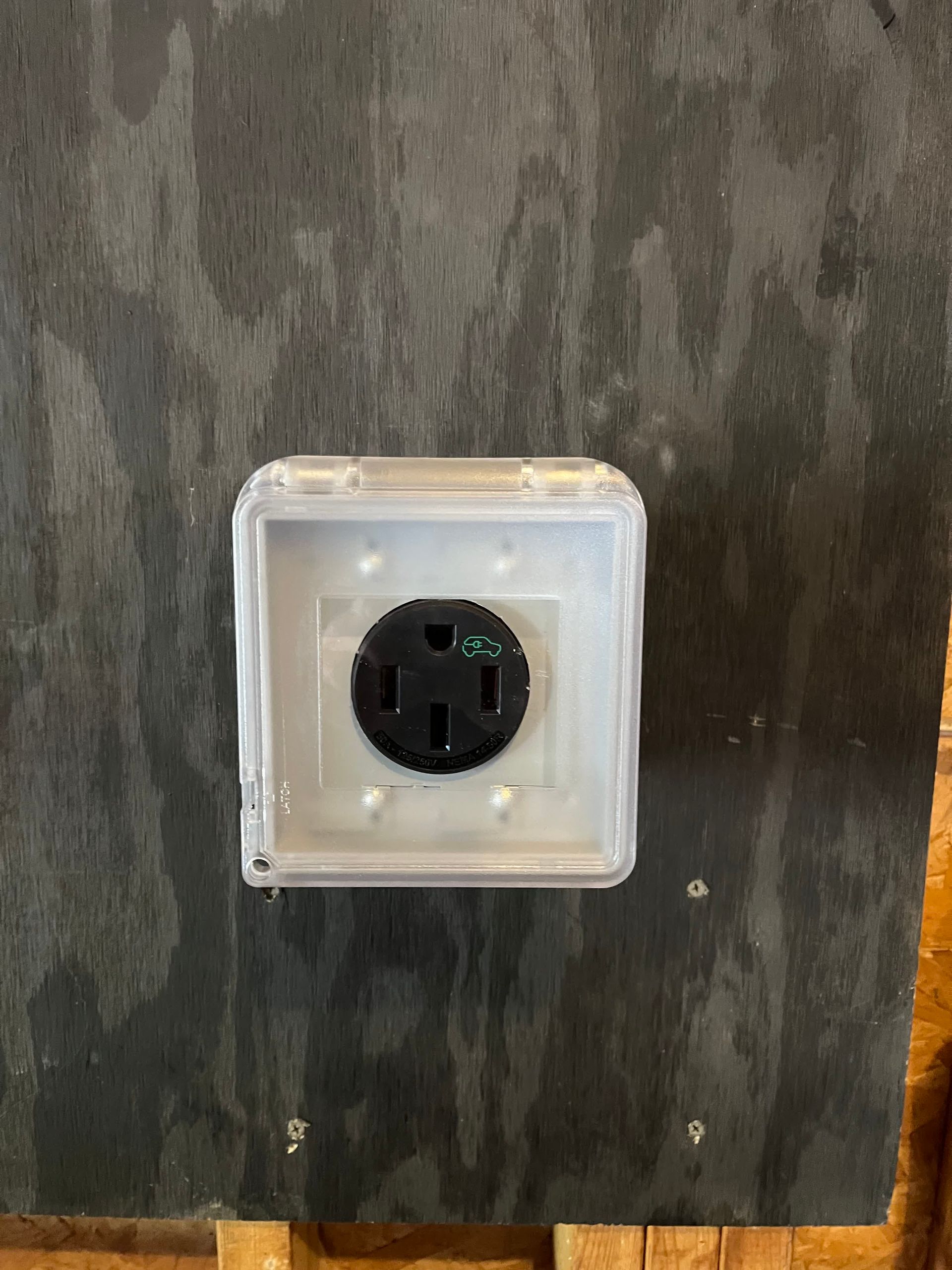 A close up of a electrical outlet on a table.