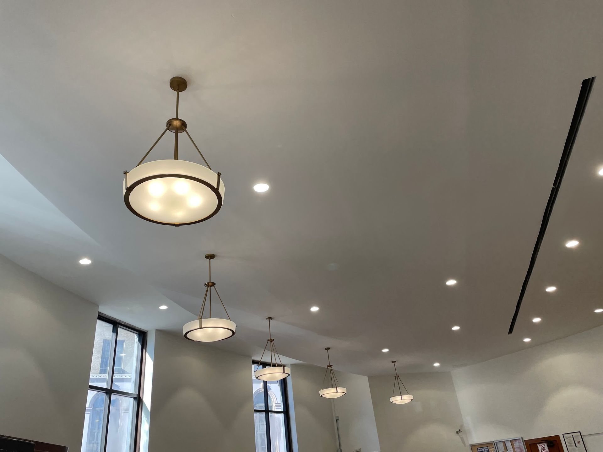 A ceiling with a lot of lights hanging from it