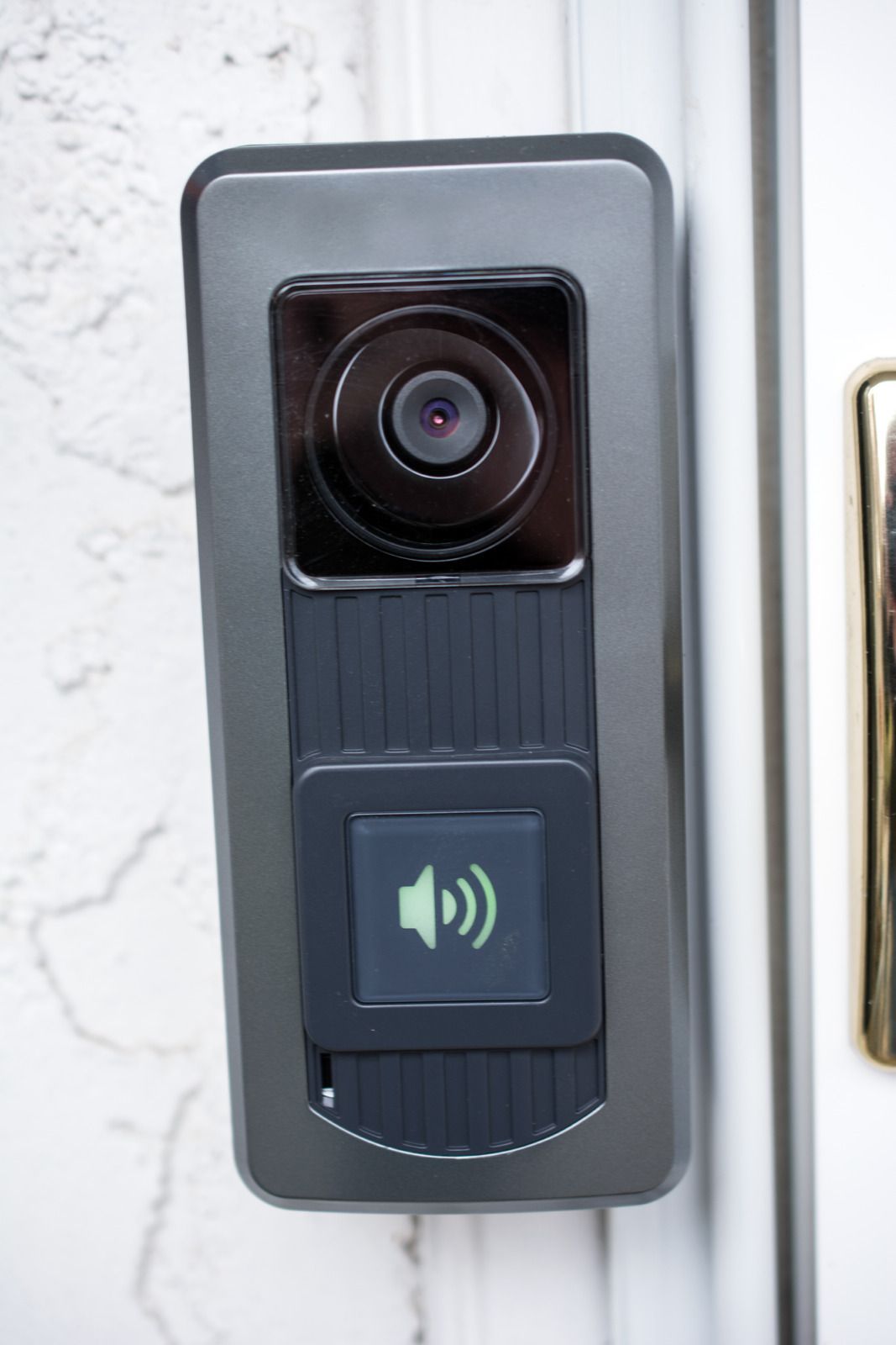 A doorbell with a camera and a button on the side of it.