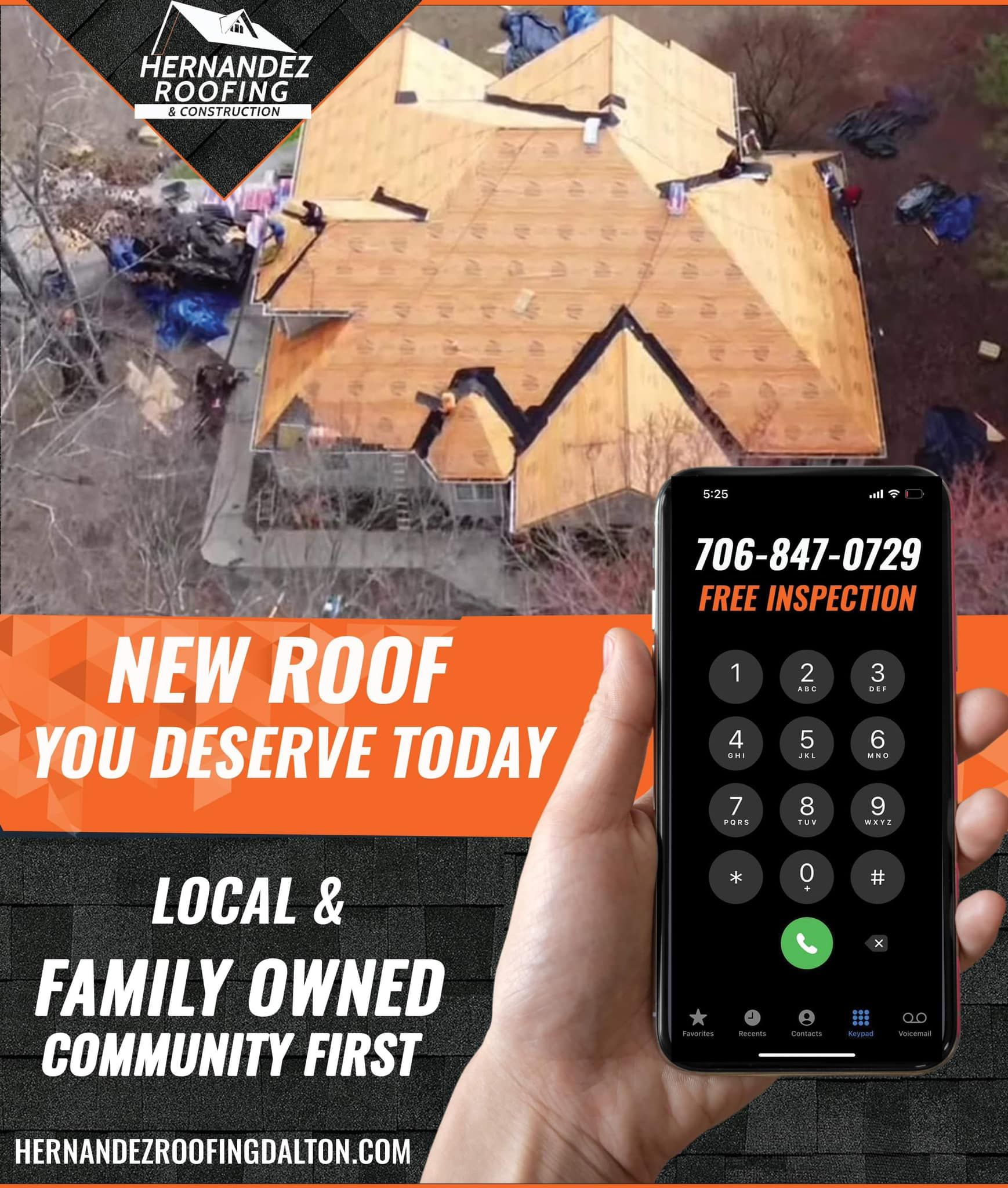 A person is holding a cell phone with a phone number on it.