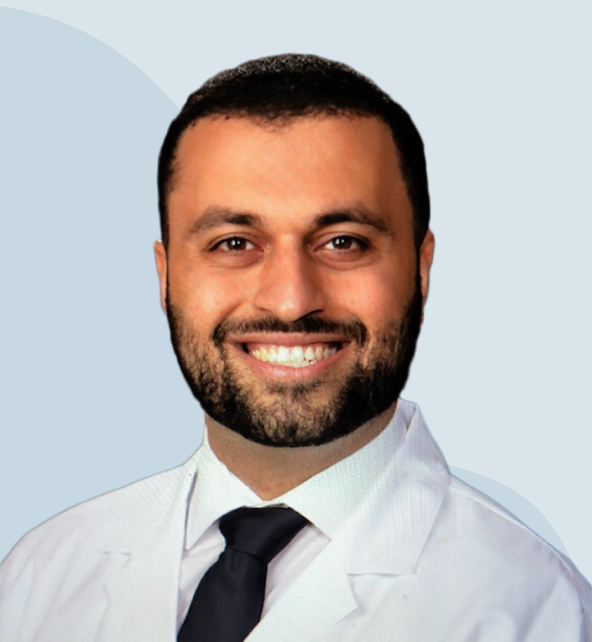 Dr. Daniel Aminpour in a white doctor's coat on a wavy blue background