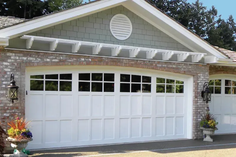 Craftsman home with white carriage-style garage door in Bellevue WA