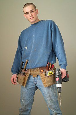 An image of someone holding a power tool.