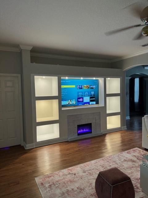 A kitchen under construction with white cabinets and a dishwasher.