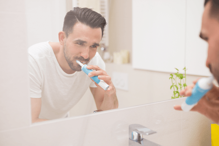General Dentist — Man Brushing His Teeth in Mansfield, OH
