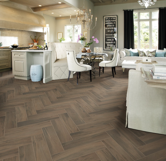 A living room with a herringbone patterned floor