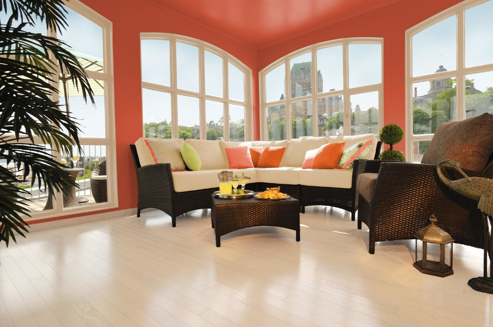 A living room with a sectional couch and a coffee table