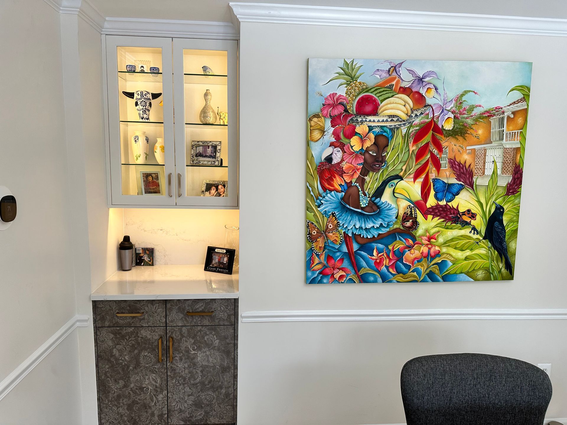 A living room with a large painting on the wall