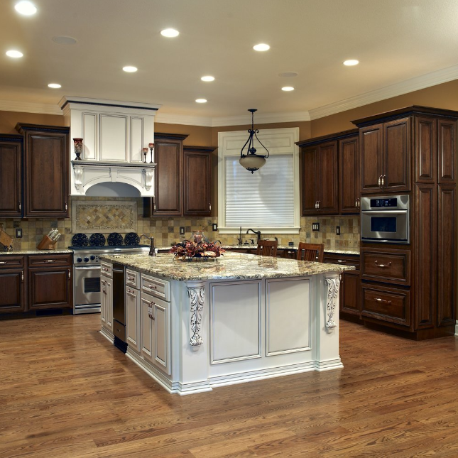 A kitchen with wooden cabinets and granite counter tops