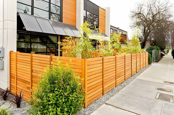 Modern horizontal wooden slat fence for home