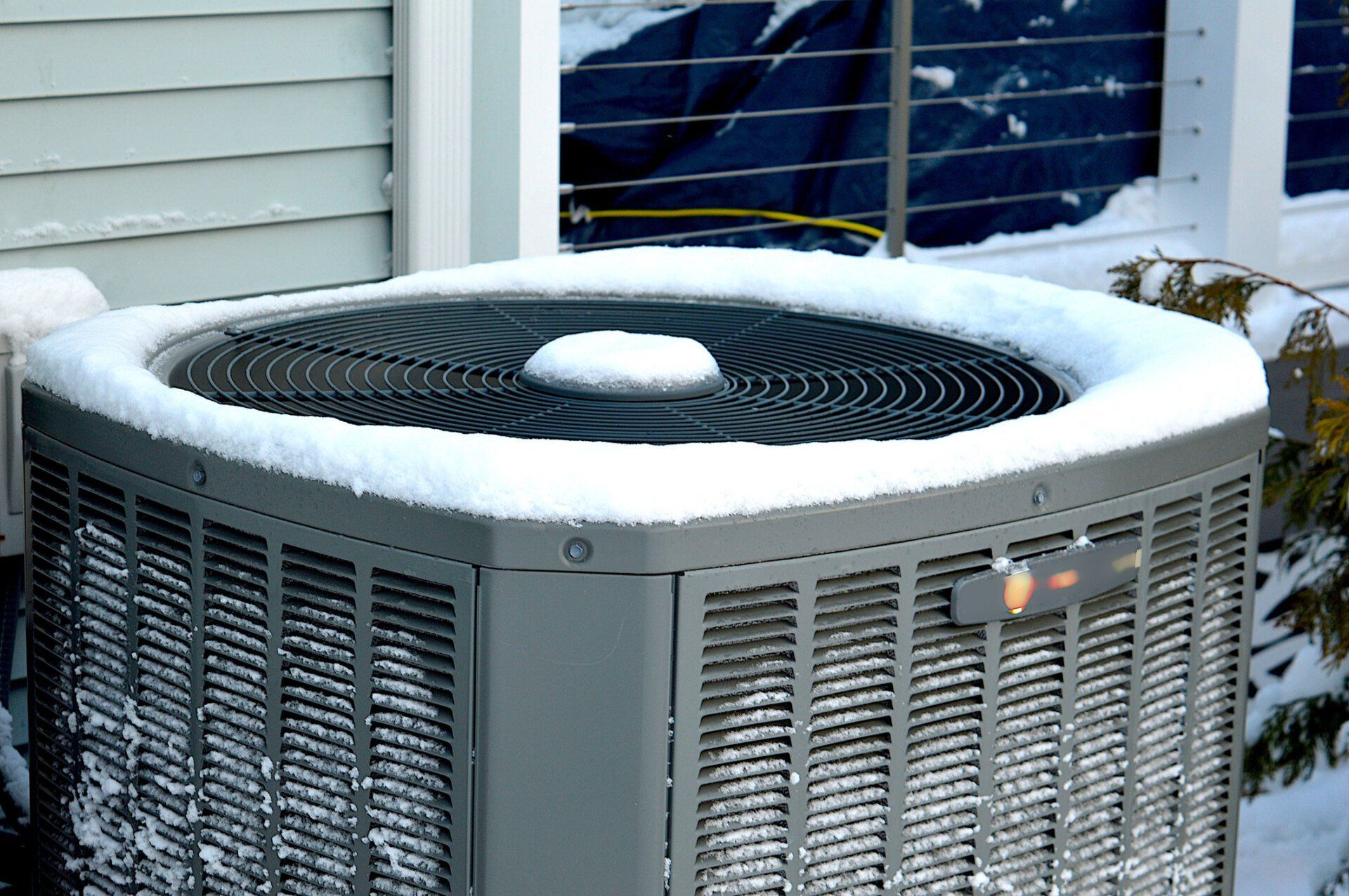 Snow Covered Outdoor AC Unit | Tucson, AZ | Miracle Air Heating & Cooling