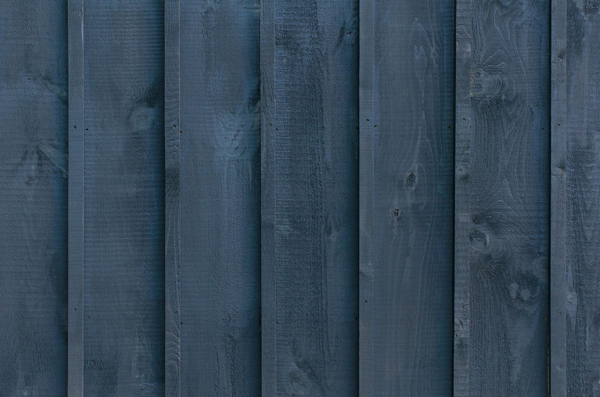 Dark blue vertical wooden planks.