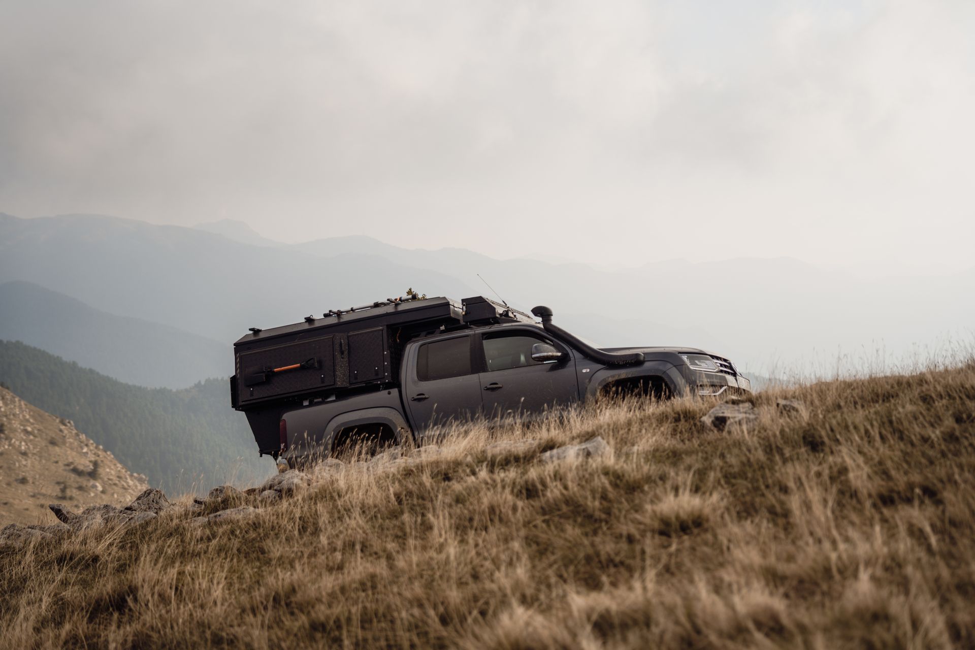 An overlanding rig on a mountain ridge 