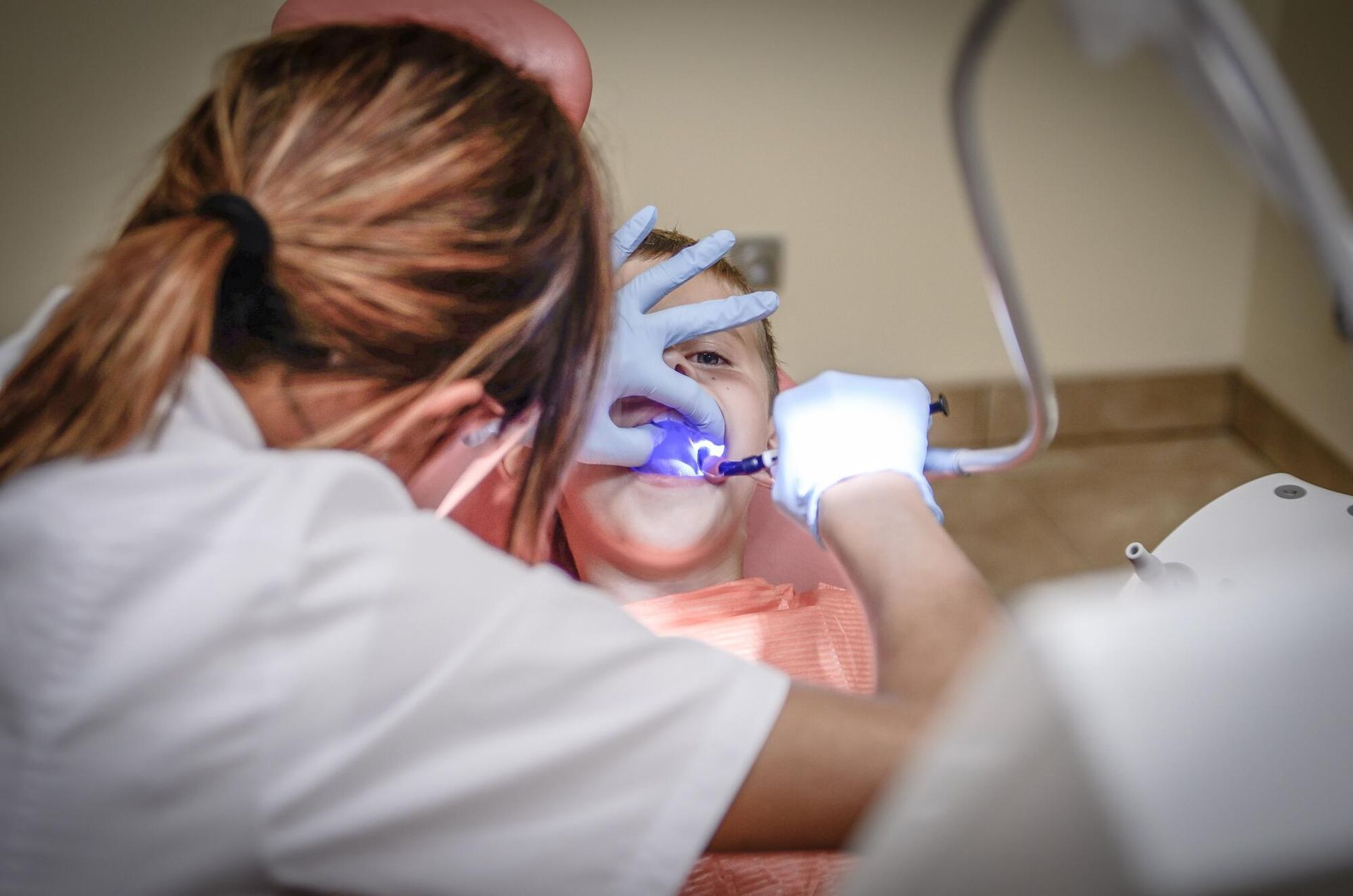 Child getting dental work done