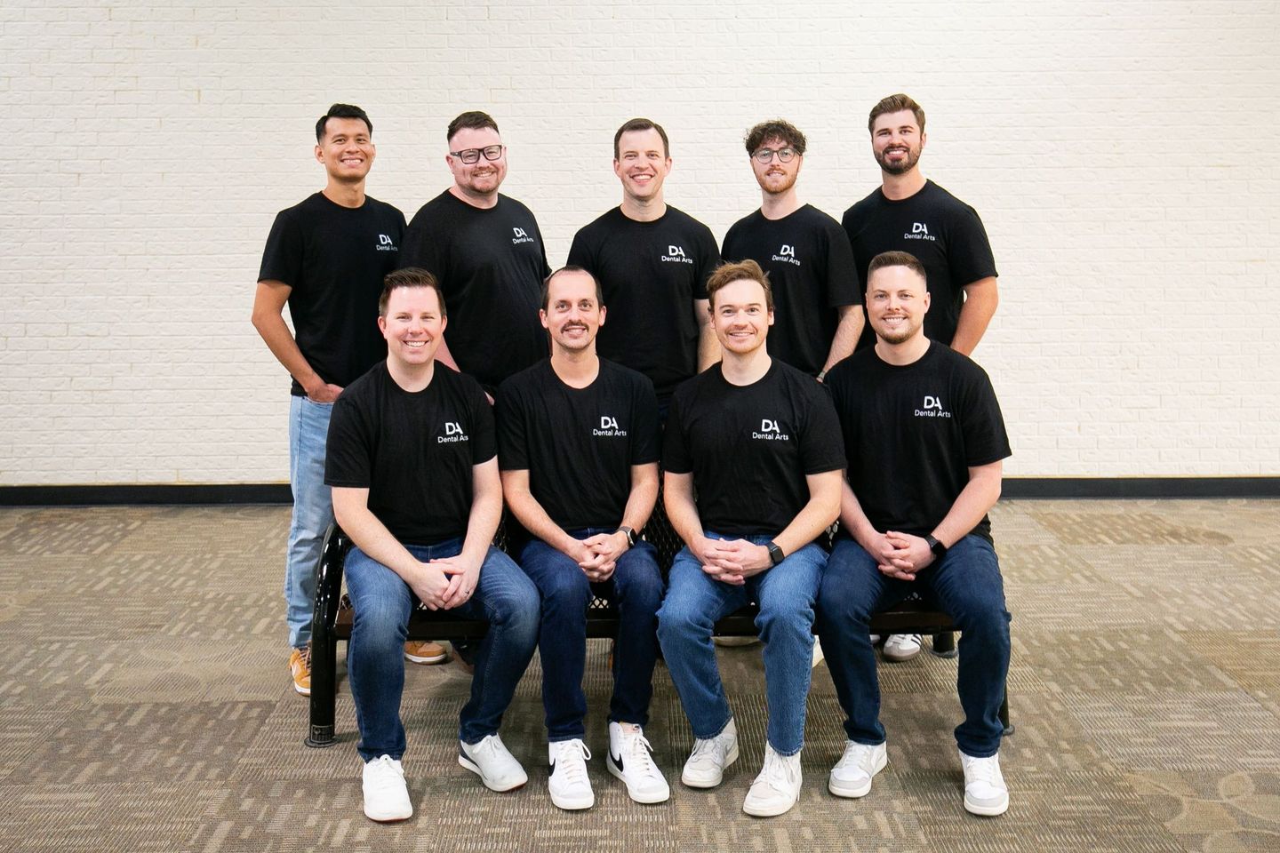 A group of men are posing for a picture together.