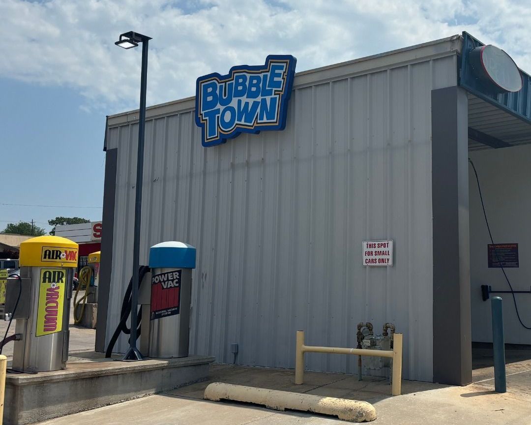 A car wash with a sign that says bubble town