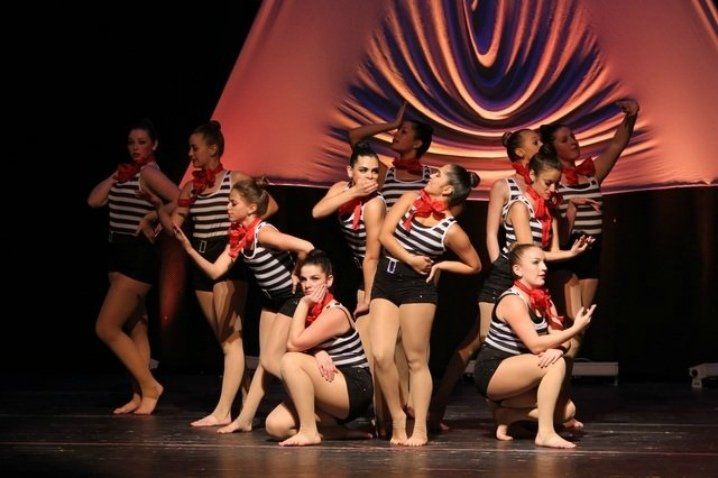 Eleven dancers at end of performance