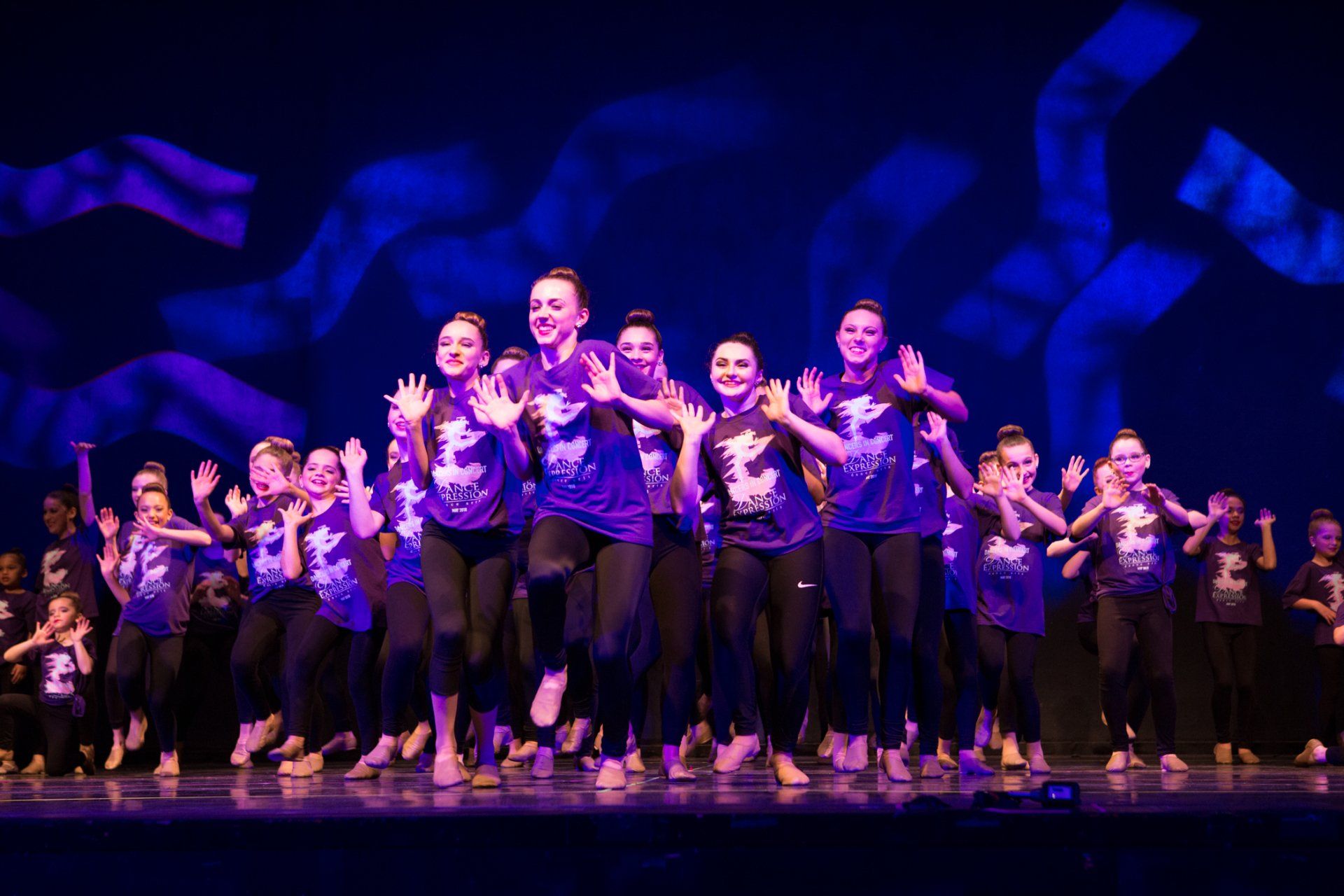 Smiling Dancers with Poinsettas