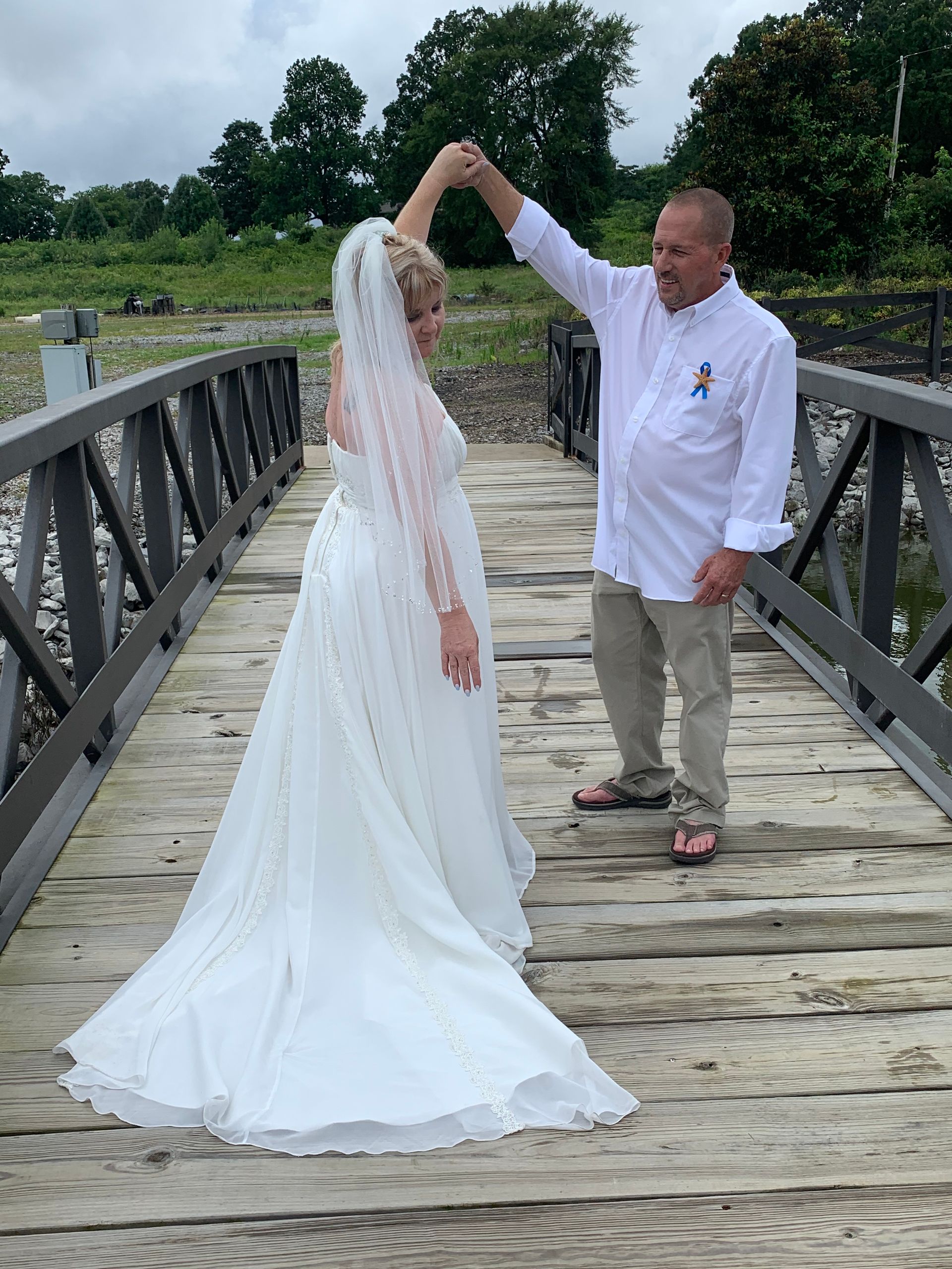 groom twirling bride
