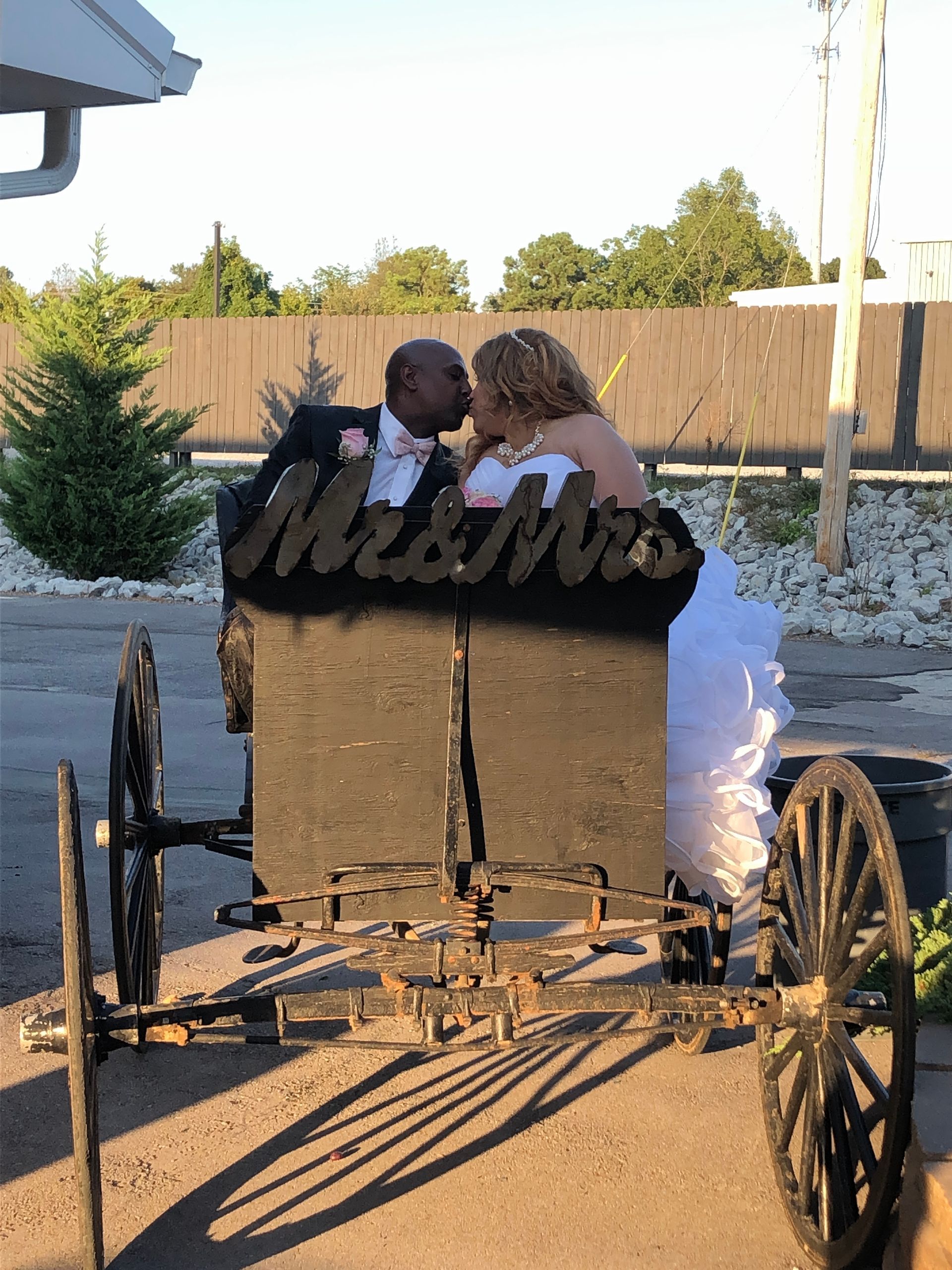 bride and groom kissing at wedding reception