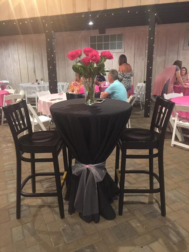 bar height table with black tablecloth