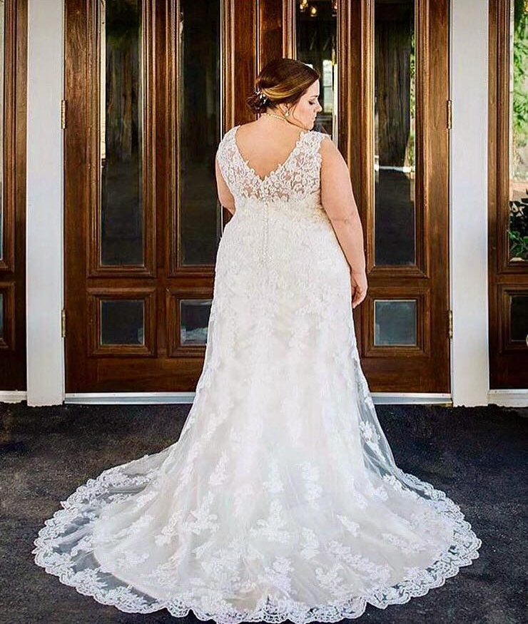 bride in flowing lace gown