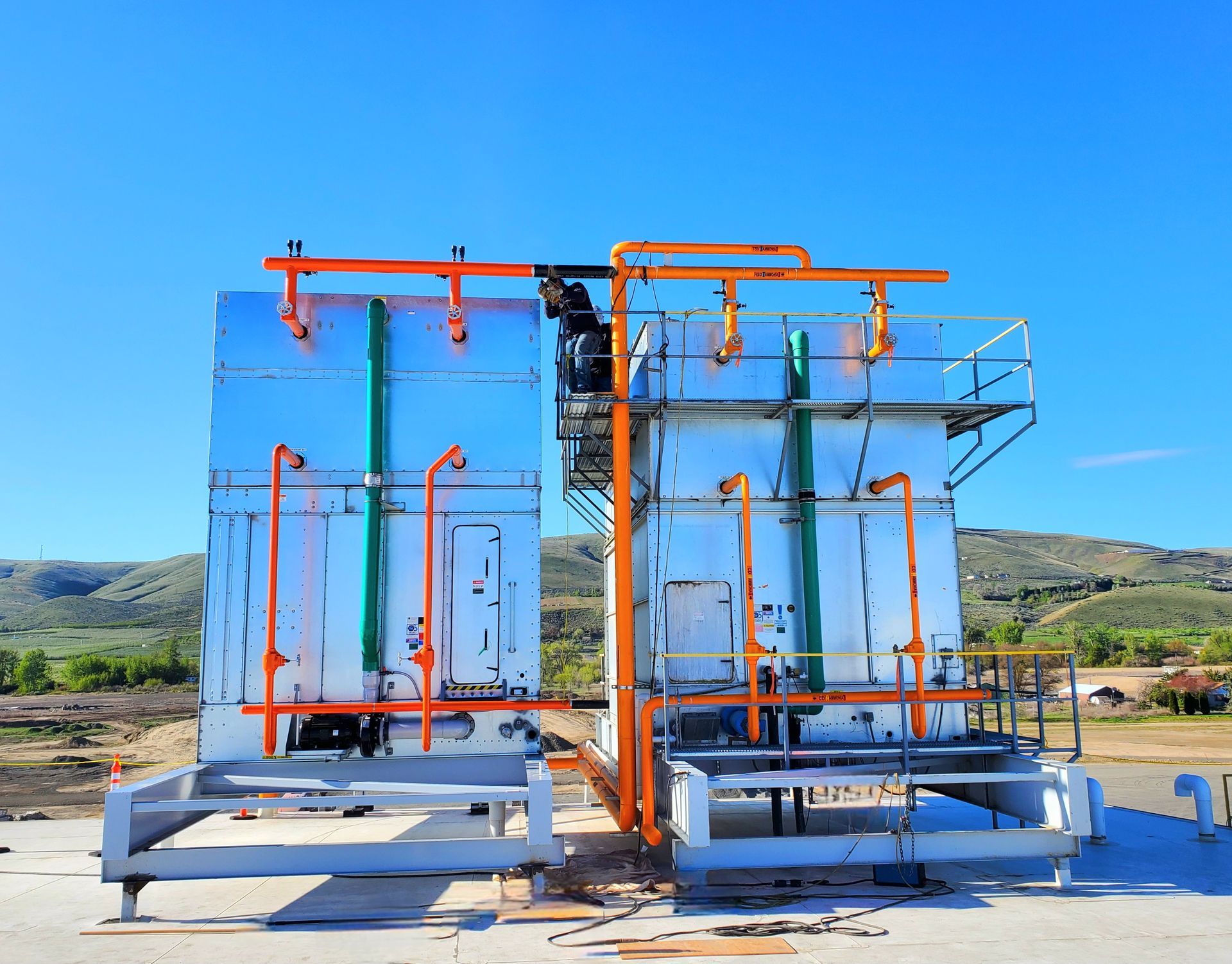 A large metal structure with a blue sky in the background