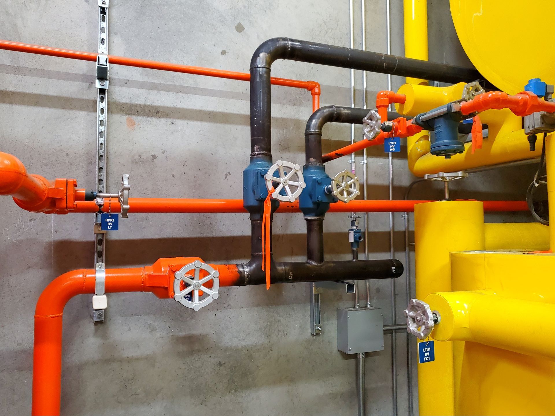 A bunch of pipes and valves in a room