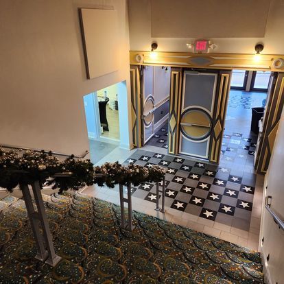 An aerial view of a building with a red exit sign