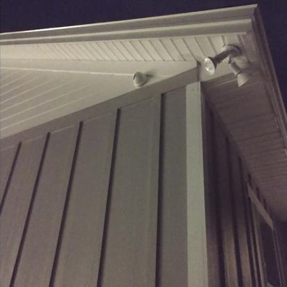 A building with a light on the side of it