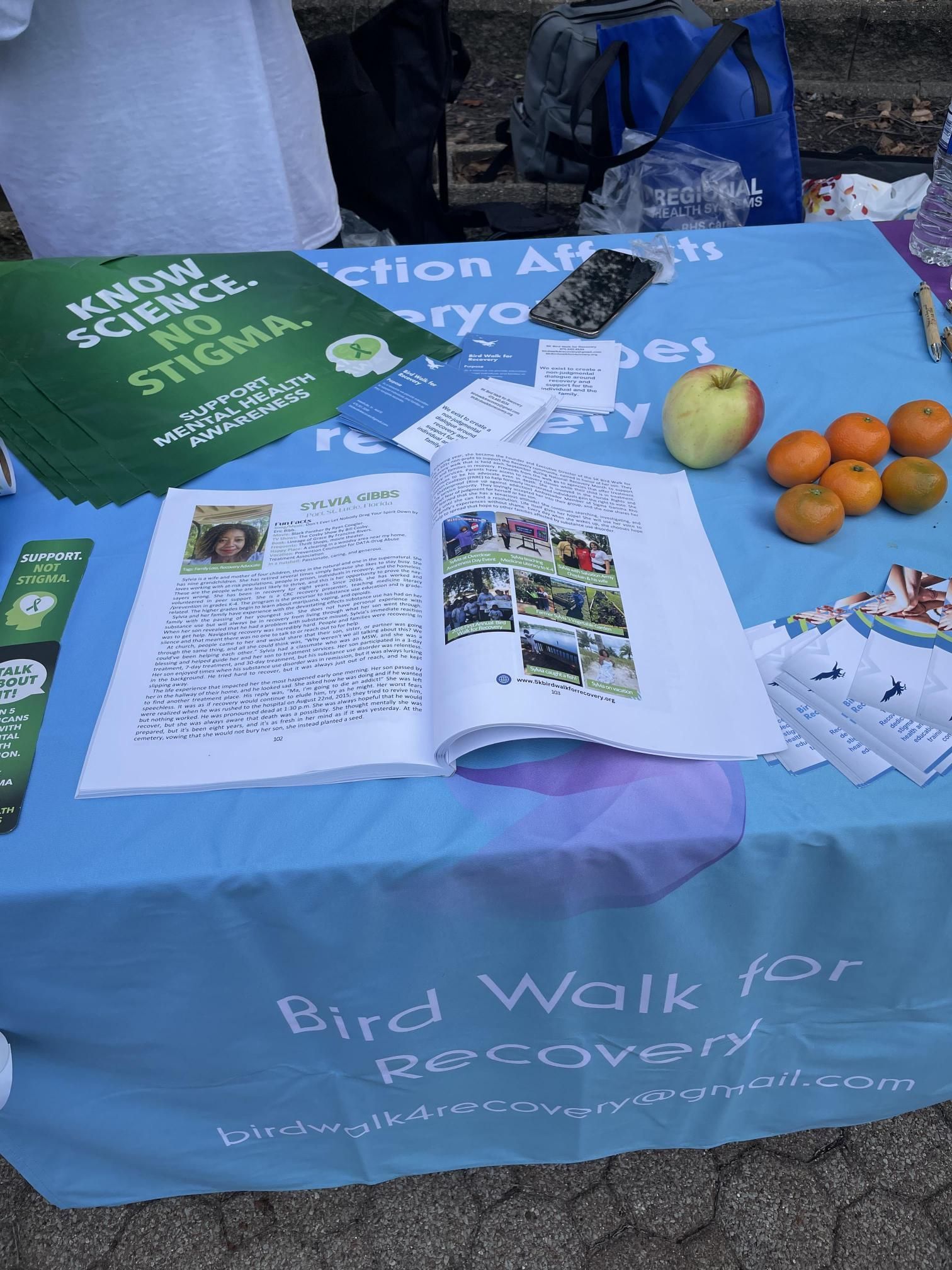 A table with a sign that says bird walk for recovery