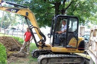 Man Operating Excavator — Drain Cleaning in Columbus, OH