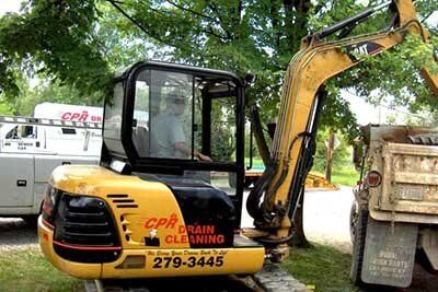 Company Yellow Excavator — Drain Cleaning in Columbus, OH Company Yellow Excavator — Drain Cleaning in Columbus, OH