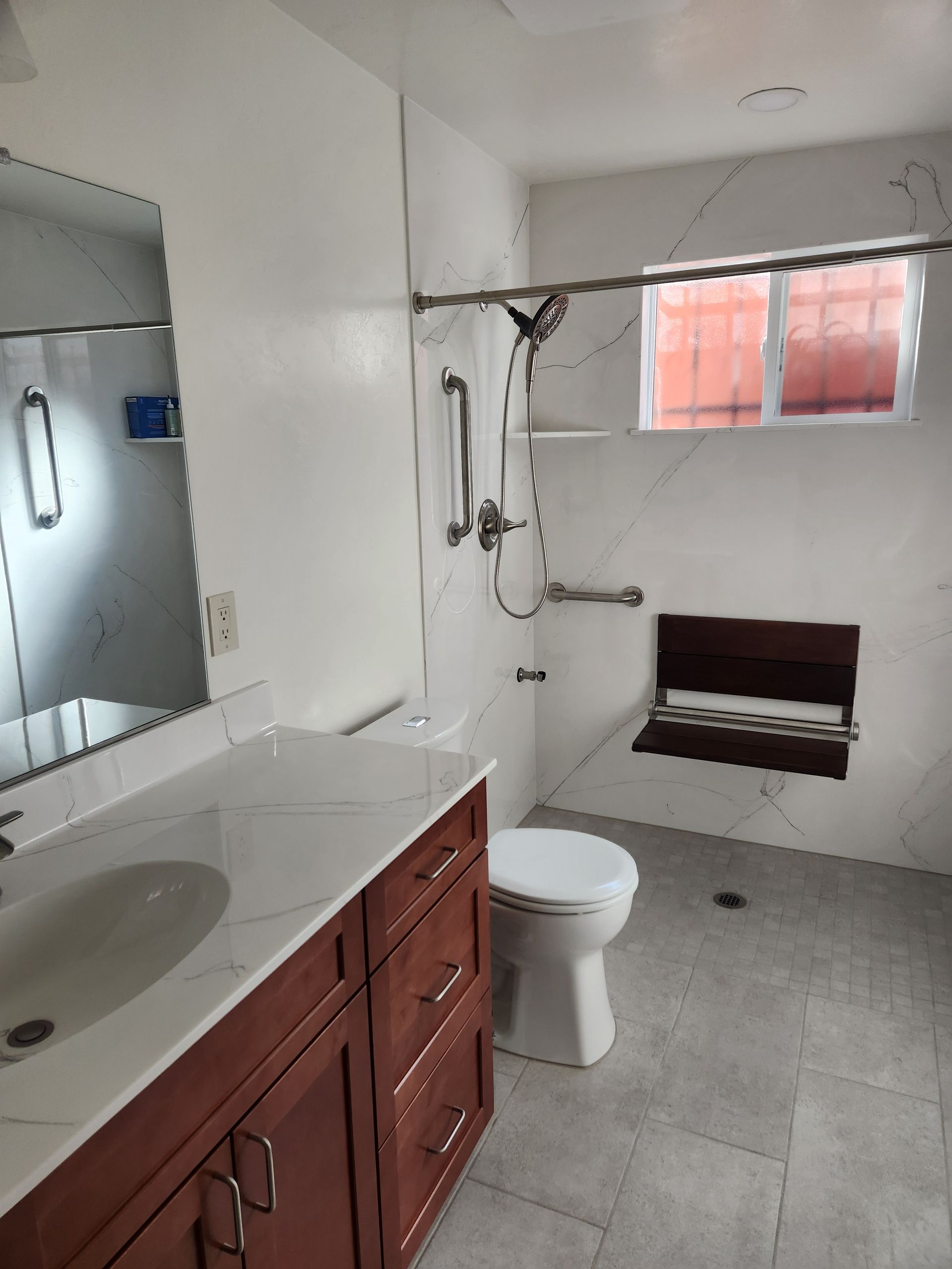 Modern tiled shower stall with a round rainfall showerhead and handheld shower rail