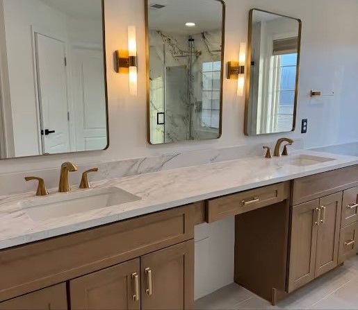 A bathroom with two sinks and two mirrors.