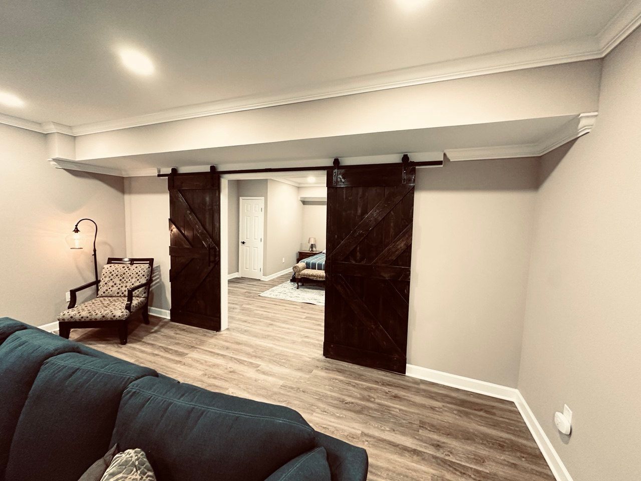 Wooden barn-style door for basement entry – rustic interior installation in Owings Mills