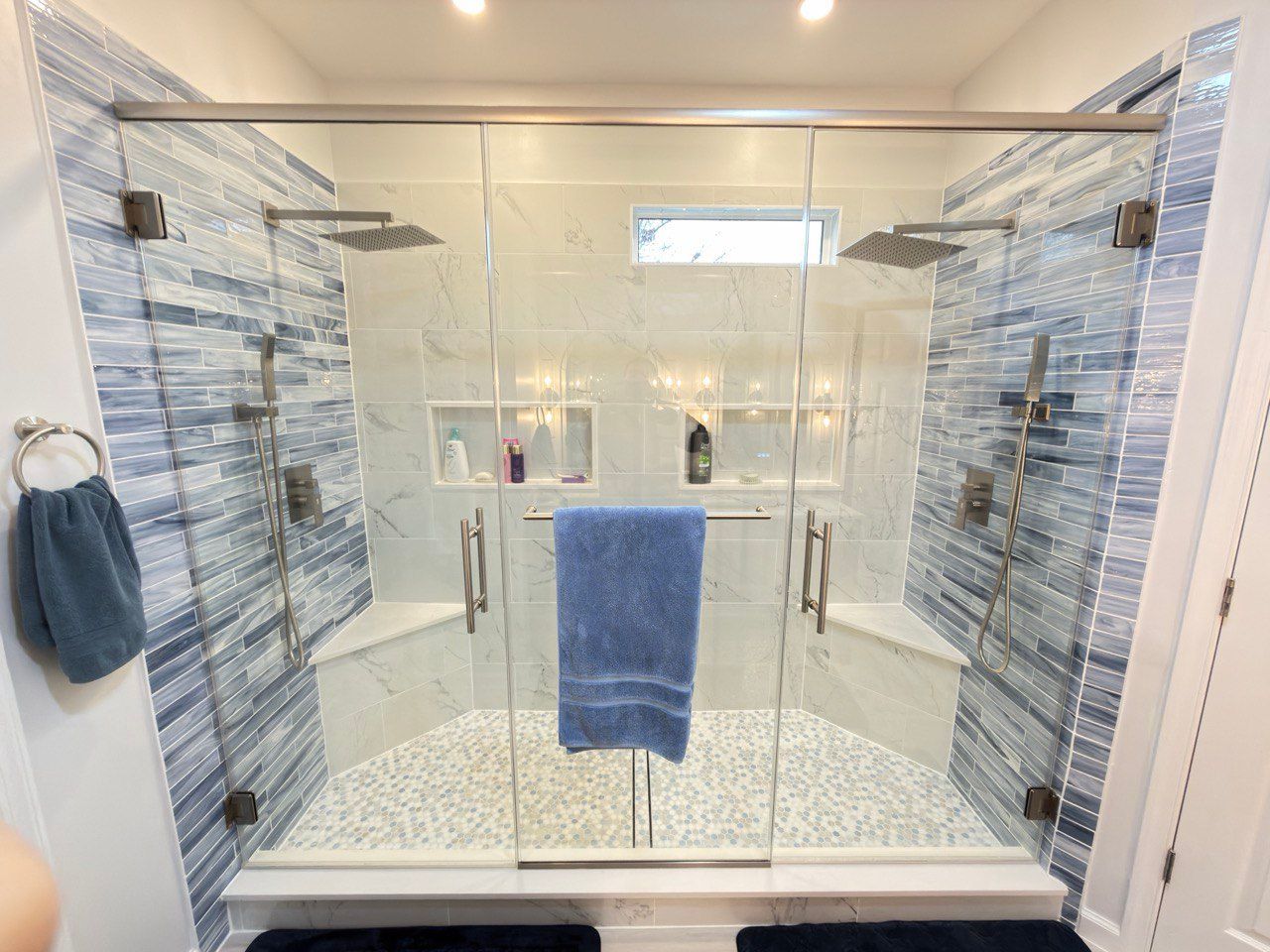 Spacious master bathroom with double sink vanity, led mirrors with sconces, brushed nikel  finishes, a two-person shower.