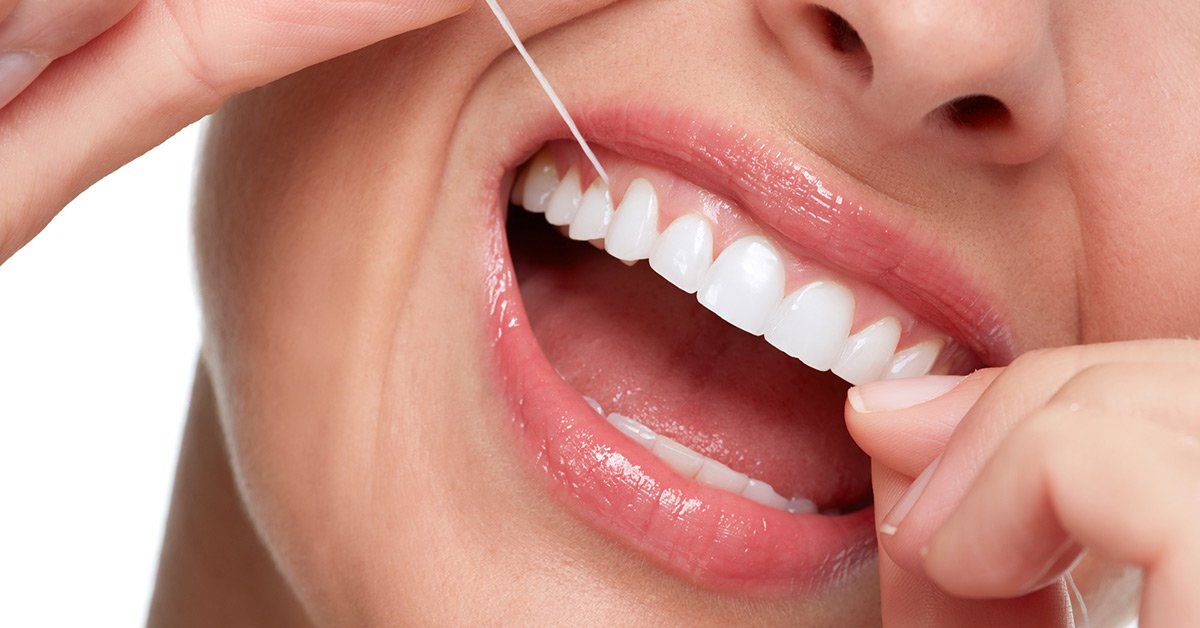 how to properly floss your teeth