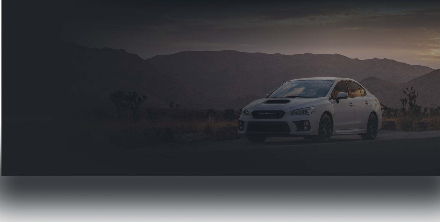 A white car is parked | Strictly Automotive Inc.