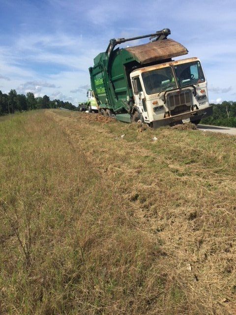 Vehicle Recovery — Green Truck on Side Road in Houston, TX